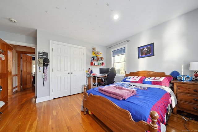16 Fullmar Ln, Norwalk, CT 06850 - bedroom with light wood-type flooring, a closet, and an office area