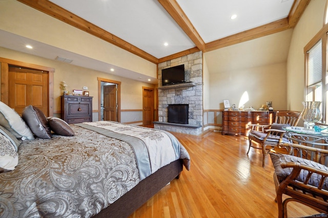16 Fullmar Ln, Norwalk, CT 06850 - bedroom featuring beamed ceiling, wood finished floors, and a stone fireplace