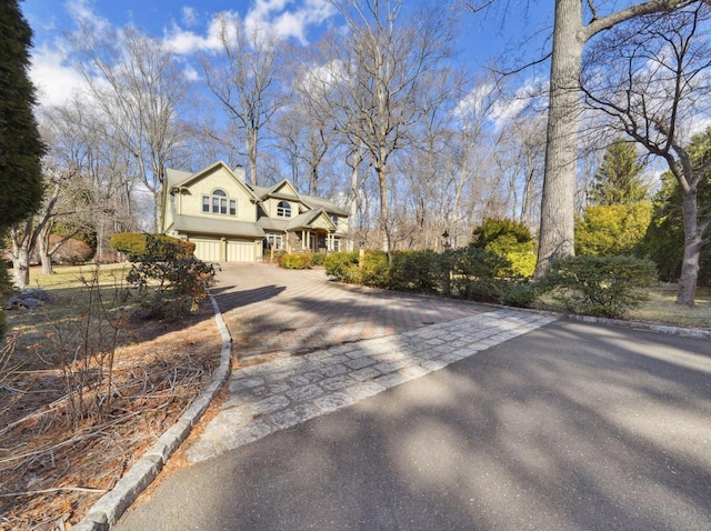16 Fullmar Ln, Norwalk, CT 06850 - view of front of property featuring an attached garage and asphalt driveway