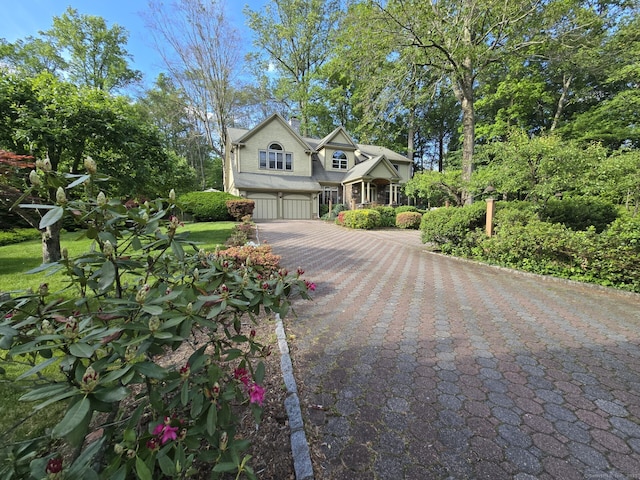 16 Fullmar Ln, Norwalk, CT 06850 - view of front of house with a garage and driveway