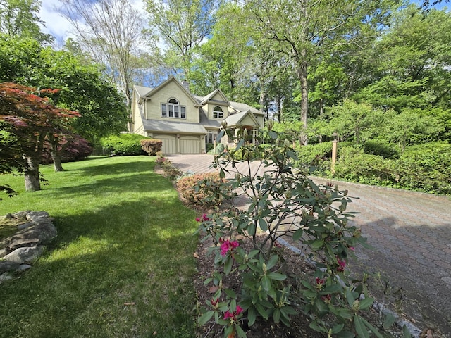 16 Fullmar Ln, Norwalk, CT 06850 - view of front facade featuring a garage and a front yard