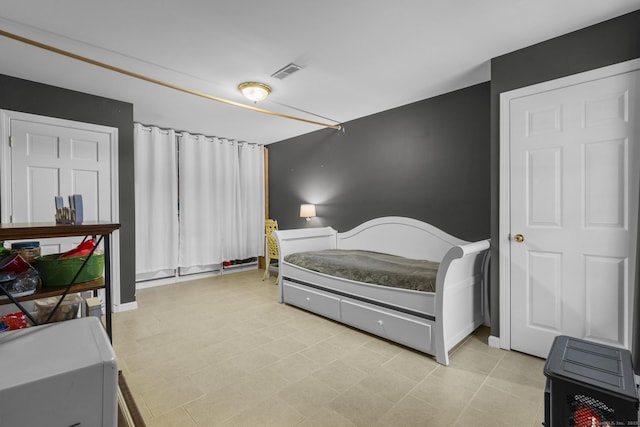 bedroom featuring visible vents