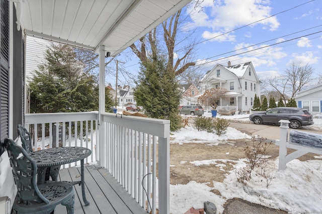 wooden deck featuring a residential view