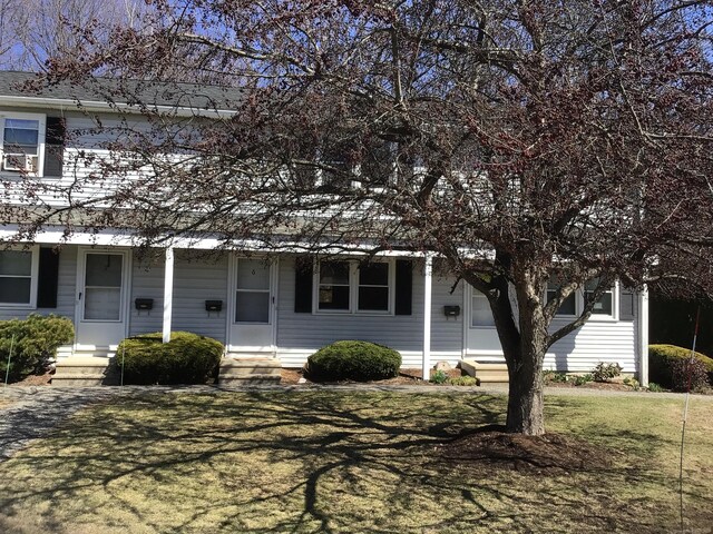 view of front of house with a front lawn and entry steps