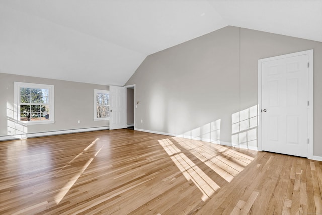 12 Nutmeg Ln, Essex, CT 06426 - unfurnished living room featuring vaulted ceiling, wood finished floors, baseboard heating, and baseboards