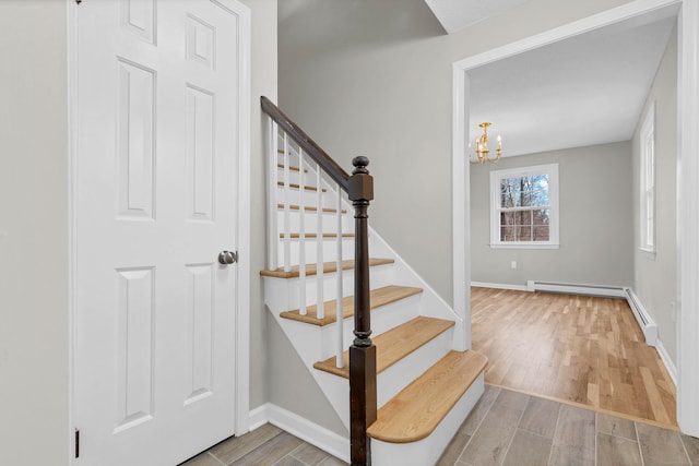 12 Nutmeg Ln, Essex, CT 06426 - staircase featuring wood finished floors, a chandelier, and baseboards
