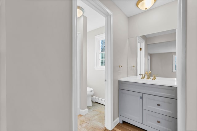 12 Nutmeg Ln, Essex, CT 06426 - bathroom with vanity, toilet, baseboards, and a baseboard heating unit