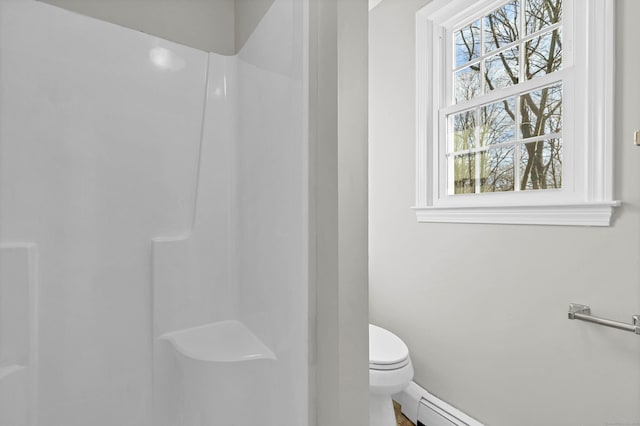 12 Nutmeg Ln, Essex, CT 06426 - bathroom featuring toilet, a shower, baseboards, and a baseboard heating unit