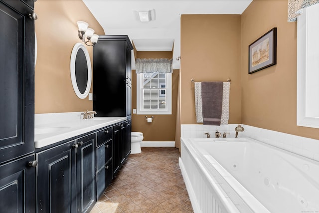 106 Chesterfield Rd, East Lyme, CT 06333 - full bathroom with toilet, a whirlpool tub, baseboards, and double vanity