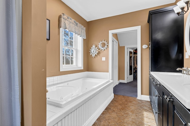 106 Chesterfield Rd, East Lyme, CT 06333 - bathroom with a whirlpool tub, double vanity, tile patterned floors, and baseboards