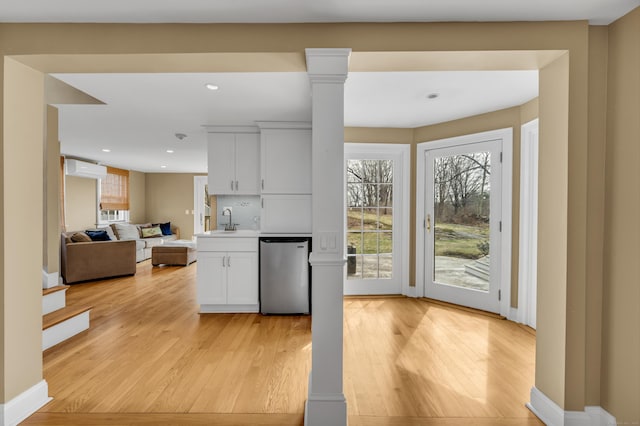 387 N River St, Guilford, CT 06437 - kitchen with dishwashing machine, a sink, light wood finished floors, healthy amount of natural light, and recessed lighting
