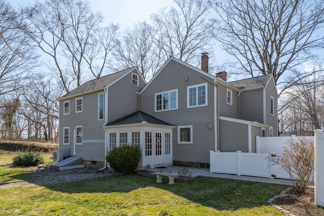 387 N River St, Guilford, CT 06437 - rear view of house with a chimney, central AC unit, and a patio