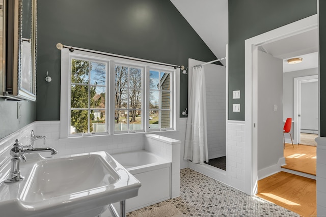 387 N River St, Guilford, CT 06437 - bathroom featuring a sink, a shower stall, a tub to relax in, lofted ceiling, and a baseboard heating unit