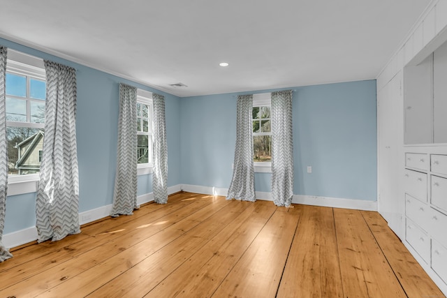 387 N River St, Guilford, CT 06437 - unfurnished room featuring baseboards, healthy amount of natural light, hardwood / wood-style flooring, and recessed lighting