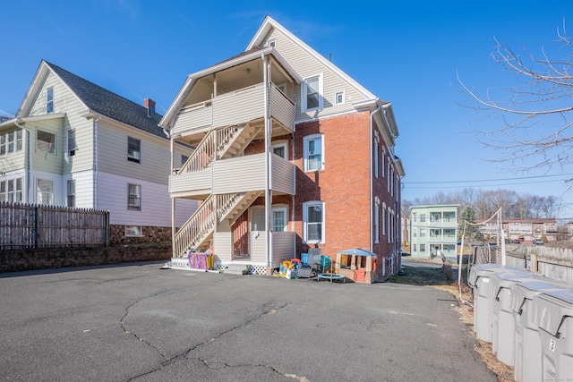 45 Willis St, Bristol, CT 06010 - back of house with brick siding and fence