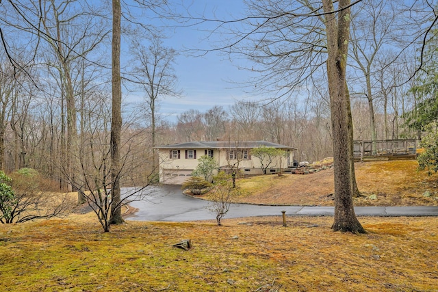 view of front of home with driveway, crawl space, and an attached garage