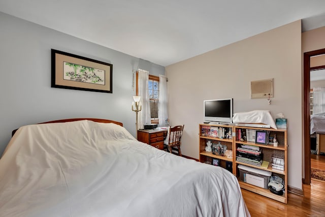 bedroom with wood finished floors
