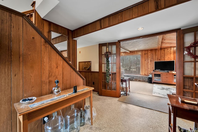 office area featuring wooden walls and wainscoting