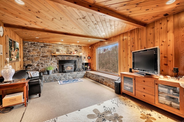 carpeted living area with wooden ceiling, wood walls, and beamed ceiling