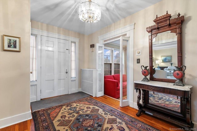 3 Middle Rd, Hamden, CT 06517 - foyer entrance featuring baseboards, an inviting chandelier, and wood finished floors