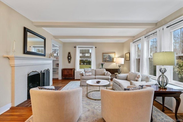 3 Middle Rd, Hamden, CT 06517 - living room with beamed ceiling, wood finished floors, and a brick fireplace