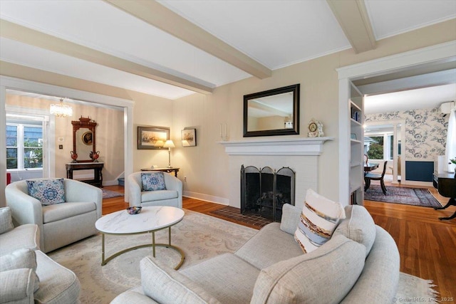 3 Middle Rd, Hamden, CT 06517 - living area with a wealth of natural light, a fireplace, beamed ceiling, and wood finished floors