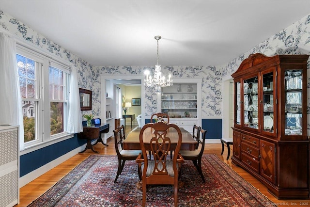 3 Middle Rd, Hamden, CT 06517 - dining area featuring a chandelier, wallpapered walls, and wood finished floors
