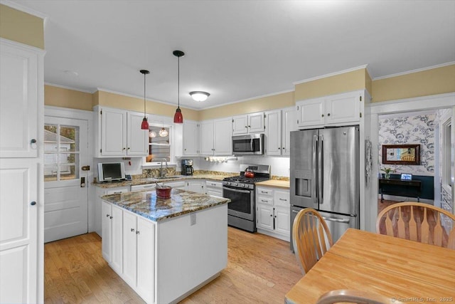 3 Middle Rd, Hamden, CT 06517 - kitchen with light wood-style floors, white cabinetry, ornamental molding, and appliances with stainless steel finishes