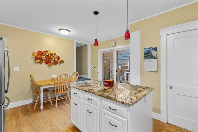 3 Middle Rd, Hamden, CT 06517 - kitchen with white cabinets, light wood-style flooring, baseboards, and crown molding