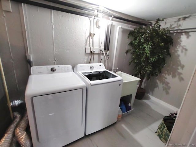 washroom featuring washer and dryer and laundry area