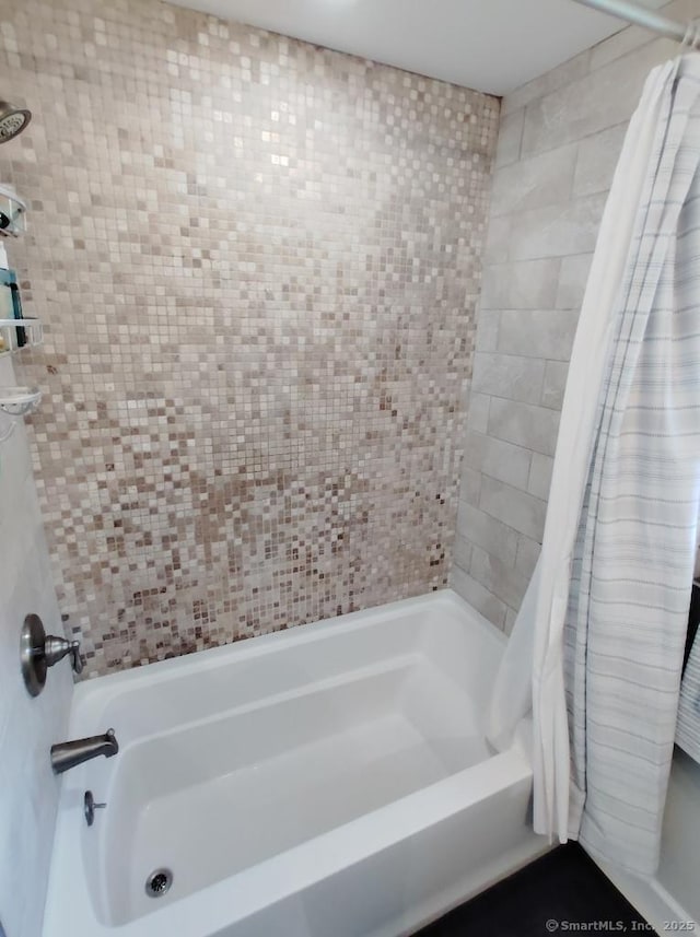 full bath with shower / bath combination with curtain