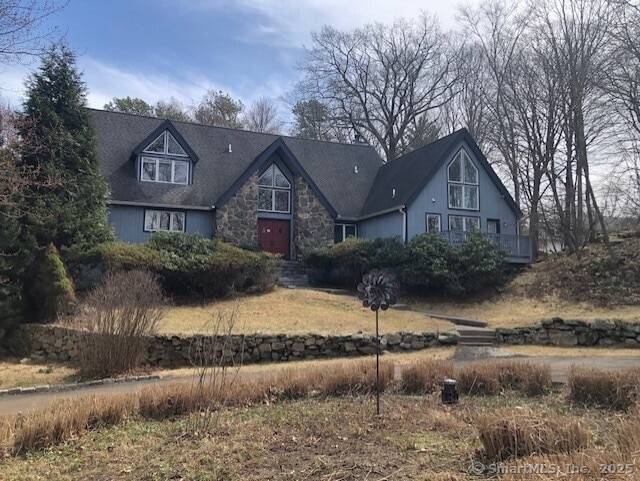 view of front of home featuring stone siding