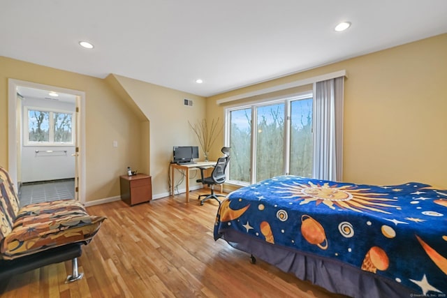 bedroom featuring recessed lighting, baseboards, and light wood-style floors