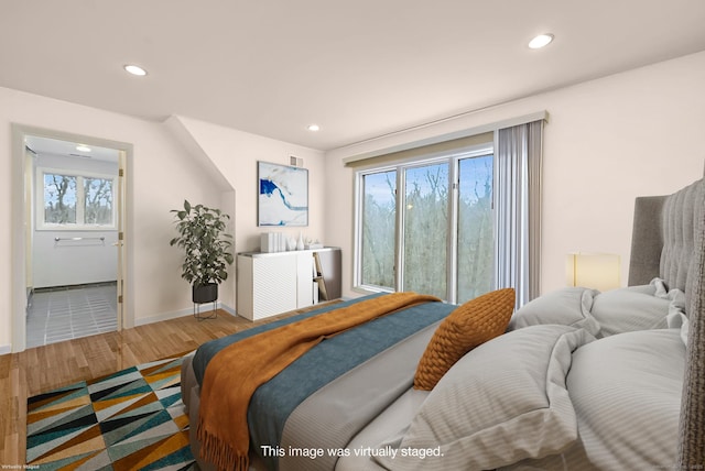bedroom featuring baseboards, recessed lighting, and wood finished floors
