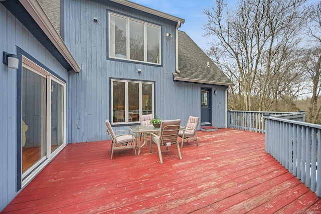 wooden deck with outdoor dining space