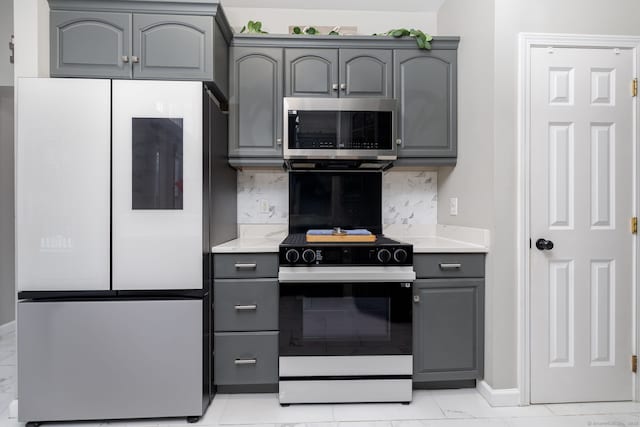 kitchen featuring light countertops, stainless steel microwave, gray cabinetry, electric stove, and smart refrigerator