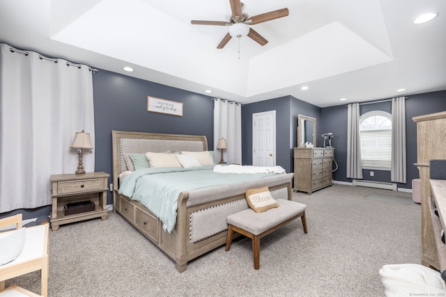 bedroom with baseboards, recessed lighting, baseboard heating, lofted ceiling, and light colored carpet