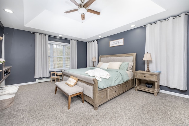 bedroom with carpet flooring, a tray ceiling, baseboards, and recessed lighting