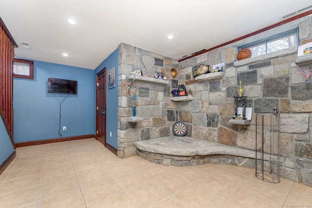 bathroom with tile patterned flooring, baseboards, and visible vents