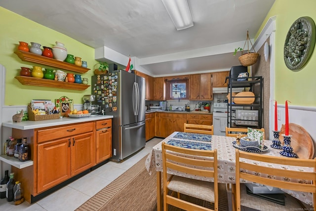 14 Overlook Pl, Stamford, CT 06907 - kitchen featuring brown cabinets, freestanding refrigerator, light tile patterned flooring, white electric stove, and open shelves