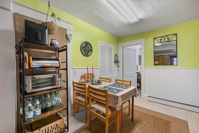14 Overlook Pl, Stamford, CT 06907 - tiled dining area with a baseboard radiator, wainscoting, and a toaster