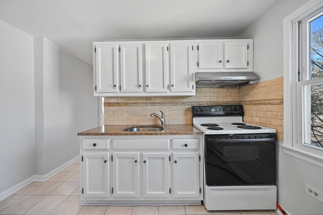 14 Overlook Pl, Stamford, CT 06907 - kitchen with electric stove, under cabinet range hood, a sink, white cabinetry, and stone counters