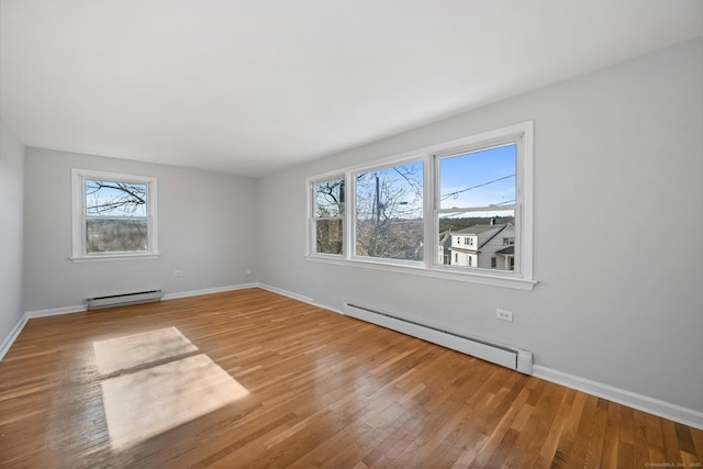 14 Overlook Pl, Stamford, CT 06907 - spare room with a baseboard heating unit, wood finished floors, and a baseboard radiator