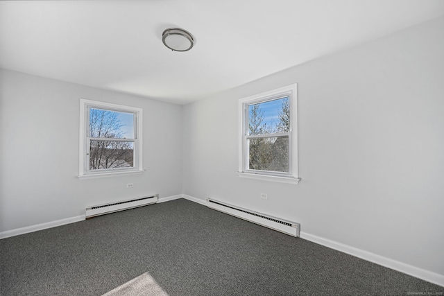14 Overlook Pl, Stamford, CT 06907 - unfurnished room featuring a baseboard heating unit, dark colored carpet, and a wealth of natural light