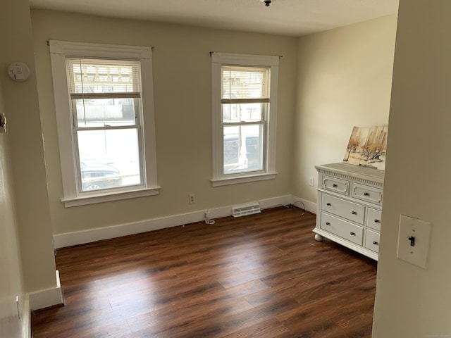 17 Easton St, Hamden, CT 06514 - unfurnished room featuring dark wood-style floors, healthy amount of natural light, and baseboards