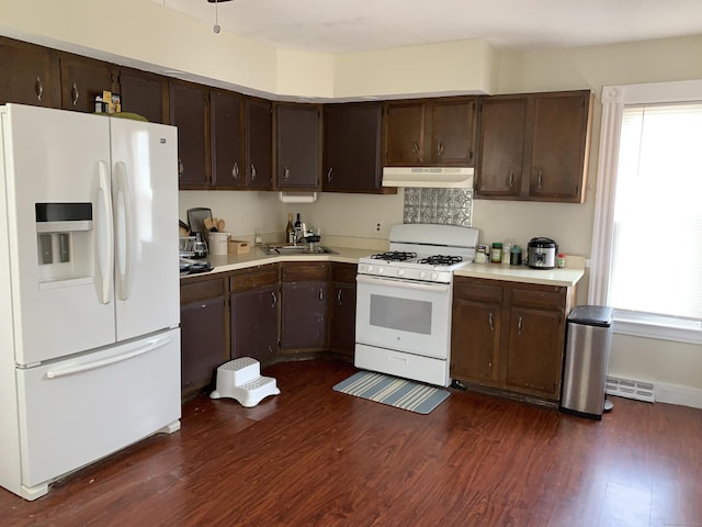 17 Easton St, Hamden, CT 06514 - kitchen with white appliances, under cabinet range hood, light countertops, and dark brown cabinetry