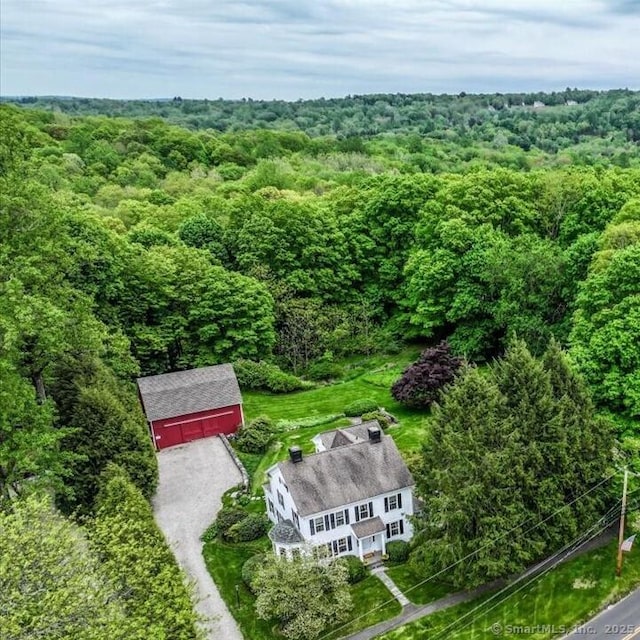 view from above of property with a forest
