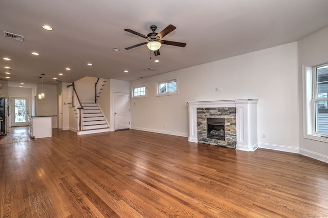 36 Deerfield Ave, Milford, CT 06460 - unfurnished living room with stairs, dark wood-style flooring, ceiling fan, and visible vents