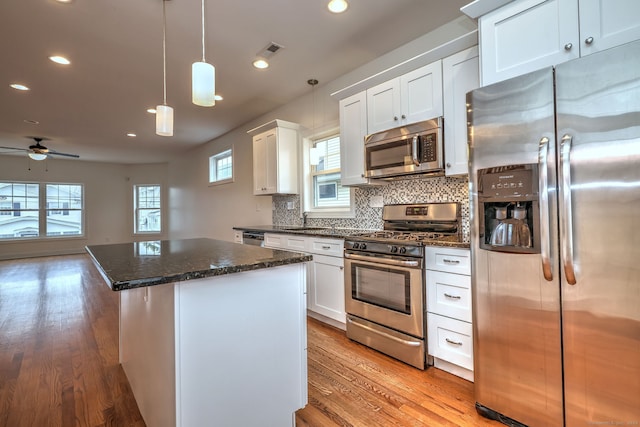 36 Deerfield Ave, Milford, CT 06460 - kitchen featuring a kitchen island, appliances with stainless steel finishes, tasteful backsplash, recessed lighting, and light wood-style flooring