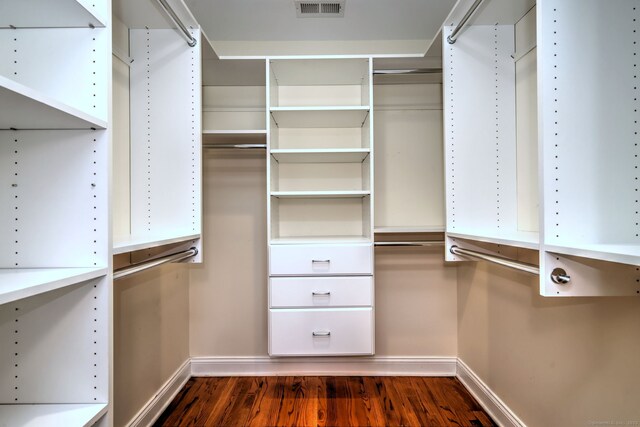36 Deerfield Ave, Milford, CT 06460 - spacious closet with dark wood-style floors and visible vents